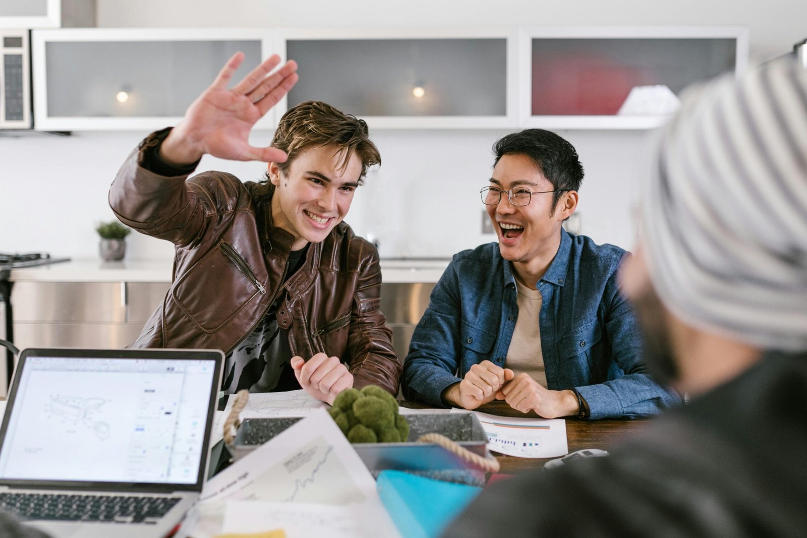 Smiling colleagues enjoying a productive meeting with high energy.